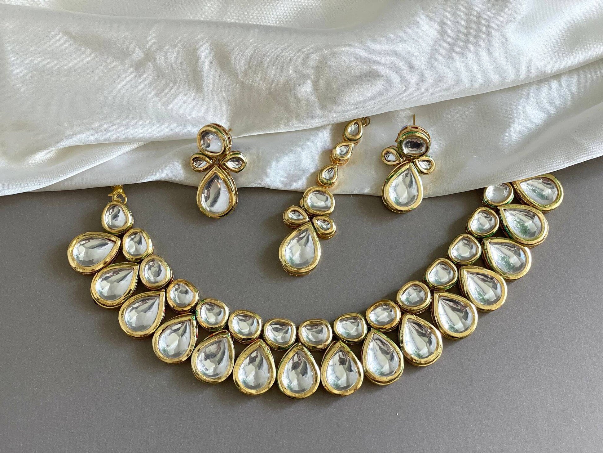 Kundan choker with pair of Earrings and tikka set