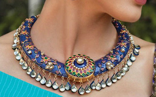 A girl wearing Meenakari jewellery