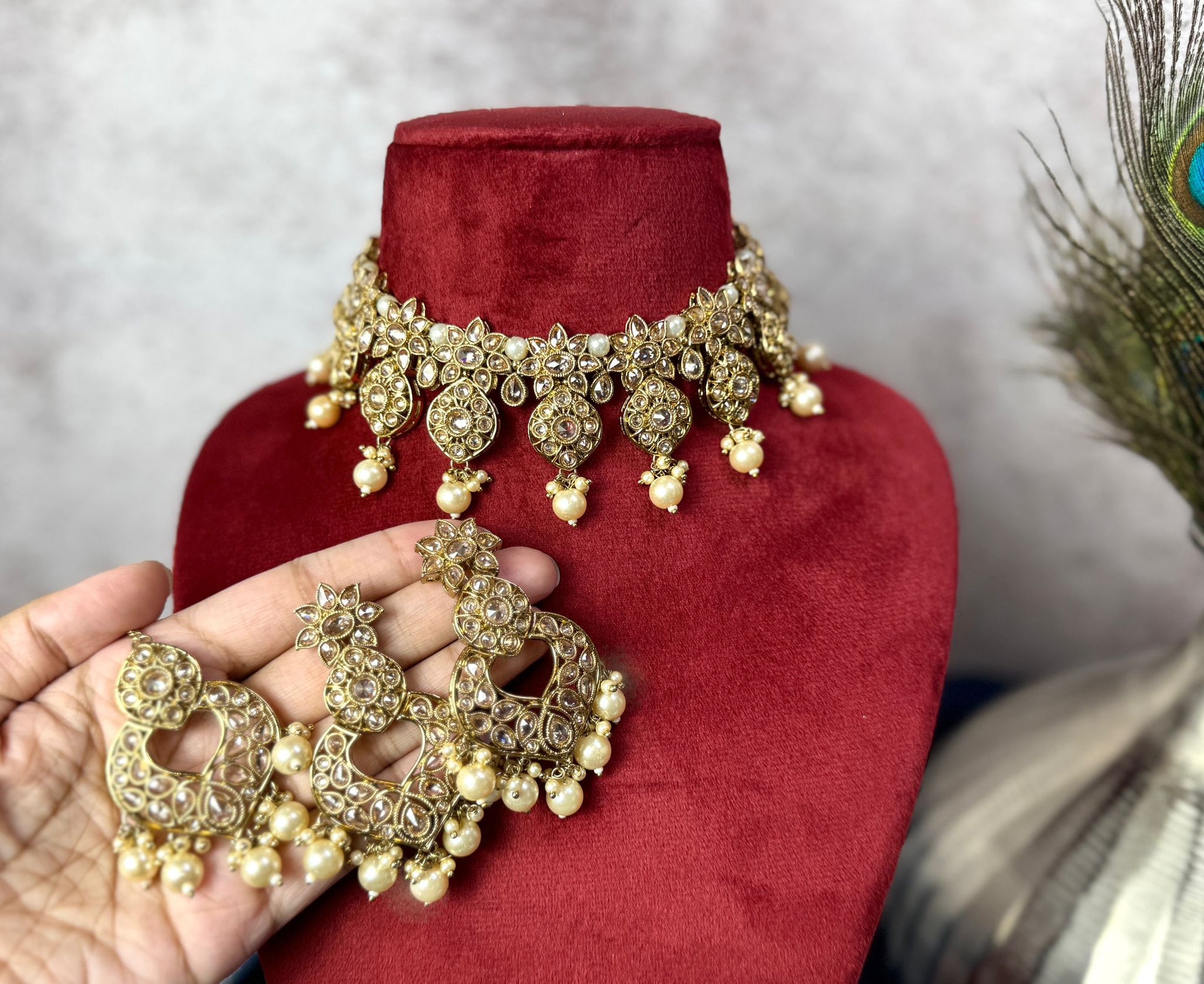 Elegant gold choker with matching earrings