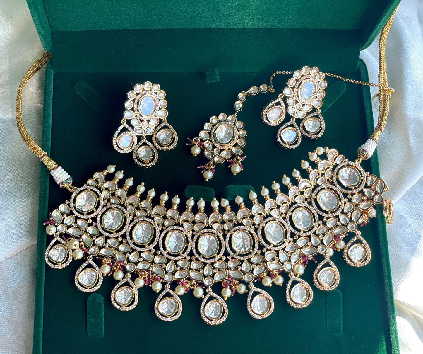 An elegant heavy necklace along with beautiful earrings