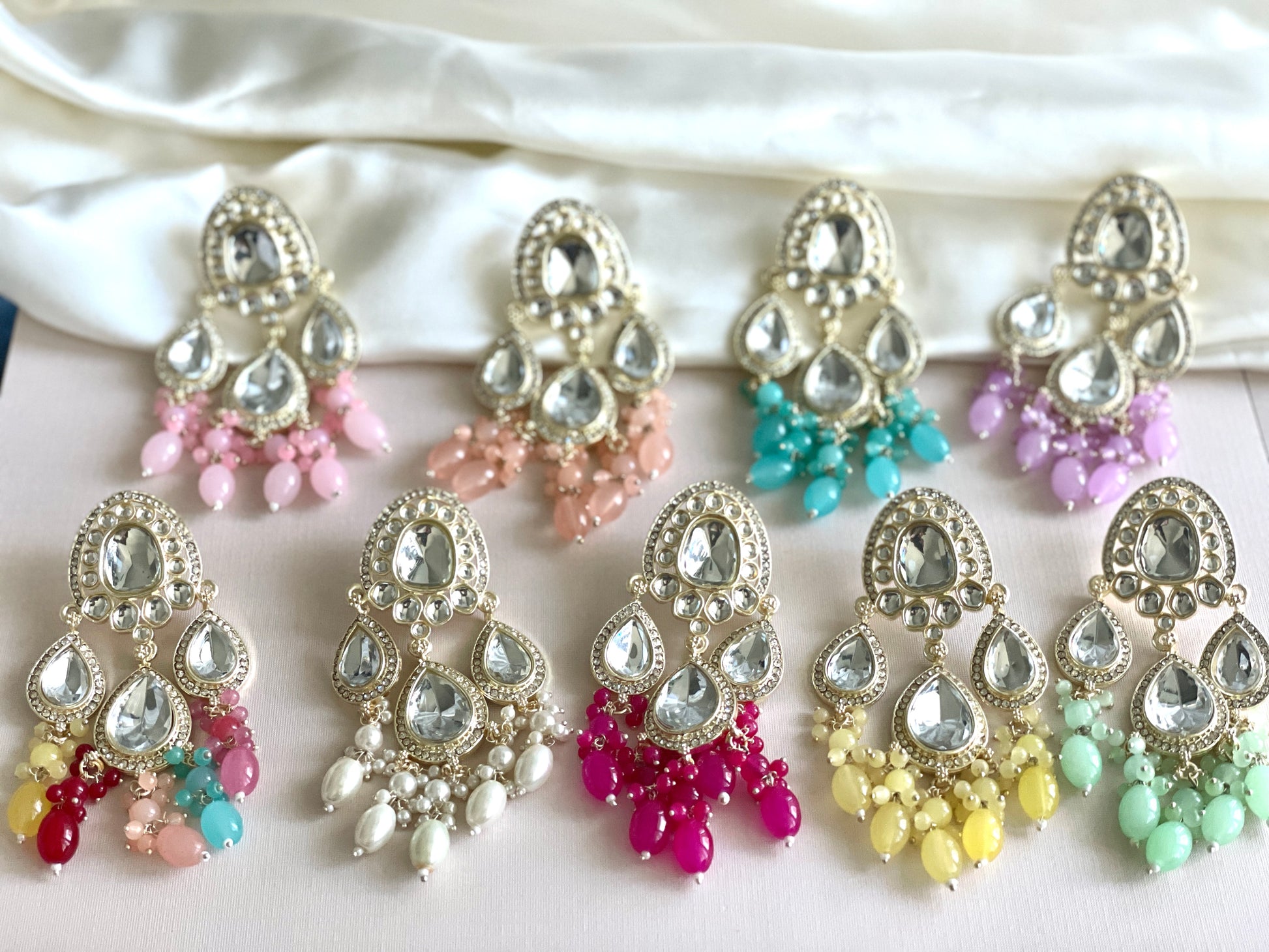 Exquisite Kundan Earrings with Dangling Charm
