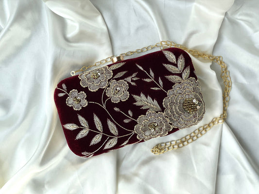 an elegant maroon embroided clutch for special occasion