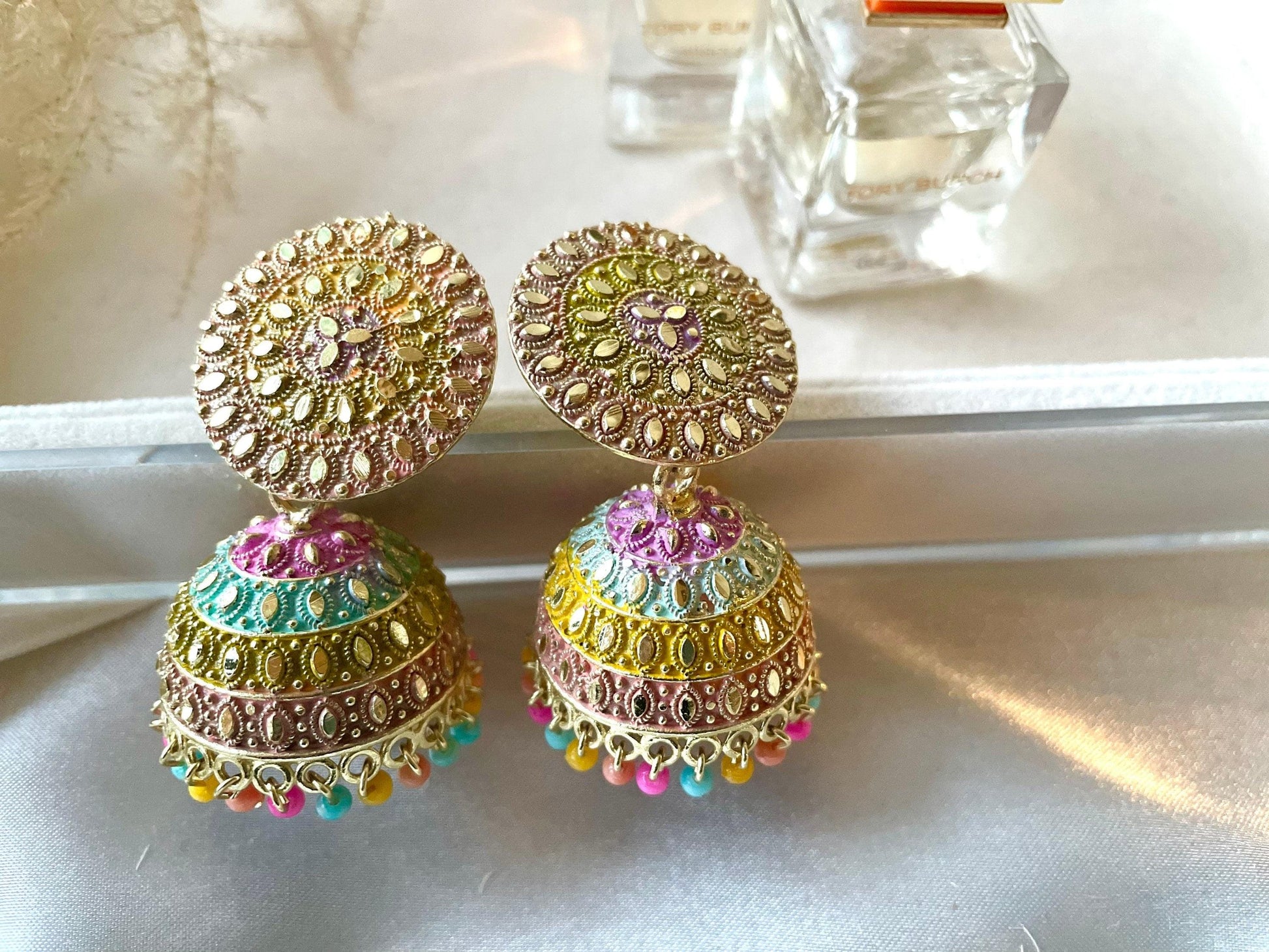 2 multi coloured jhumkas in one frame 