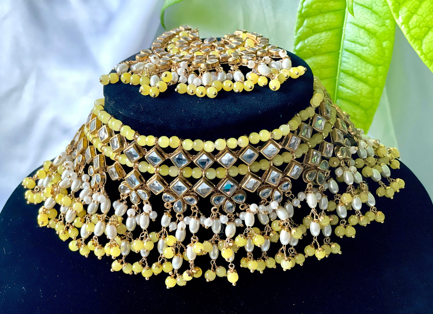 Elegant yellow set with pair of earrings and tikka set